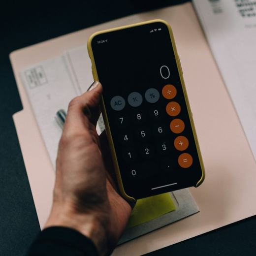 Calculator and invoices on a desk